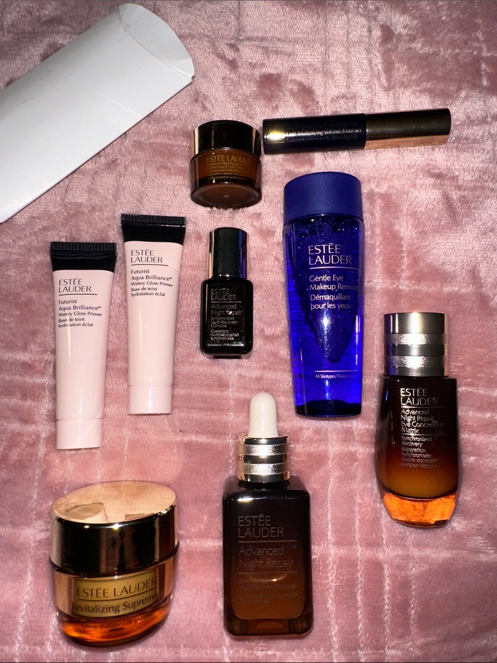 Estee Lauder Skincare Assortment with Blue, Pink, Gold and Brown Accents